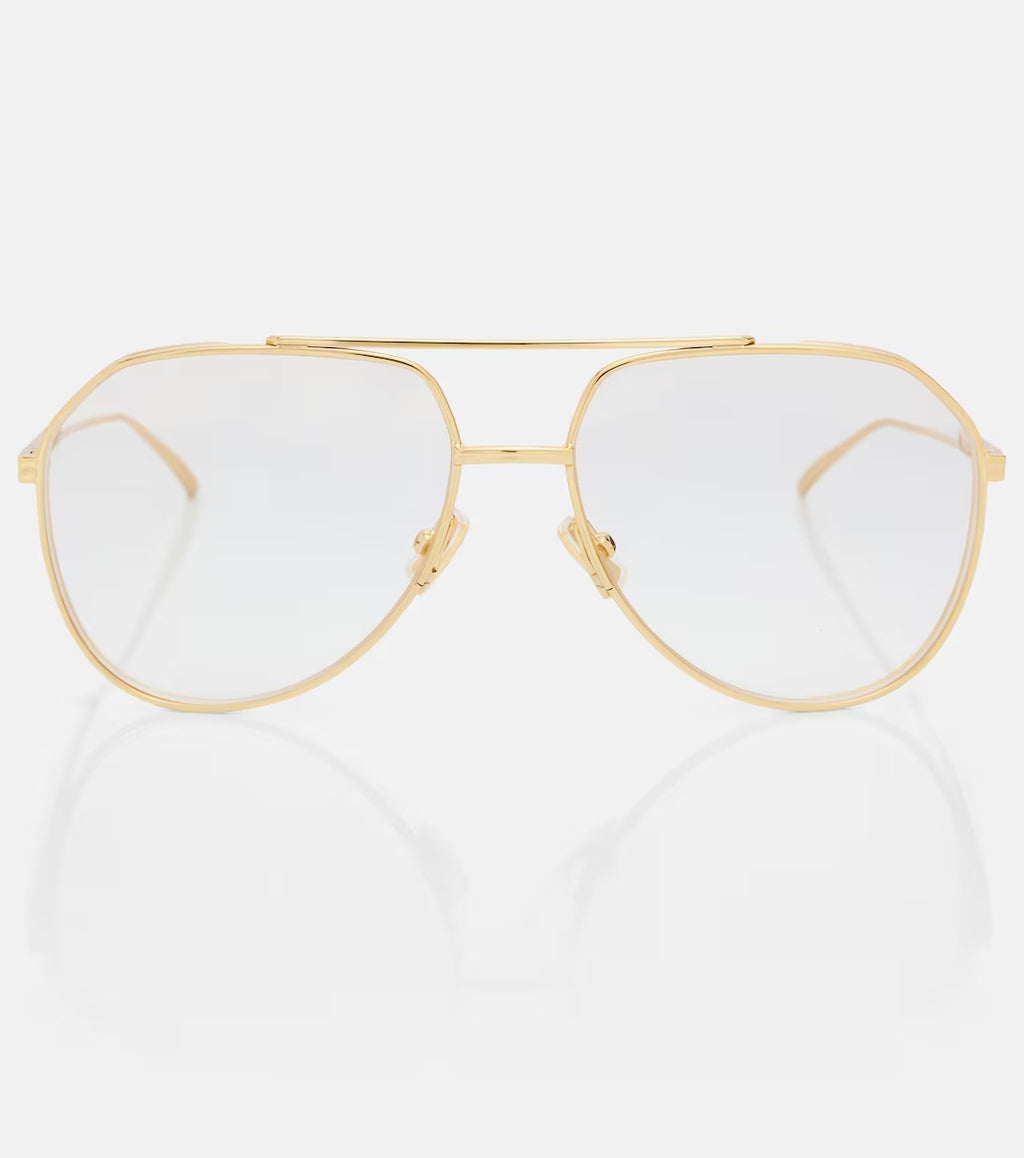 Gold-framed eyeglasses on a white background
