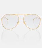 Gold-framed eyeglasses on a white background