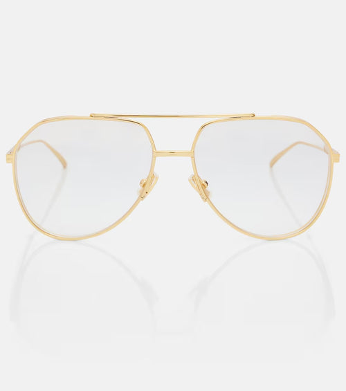 Gold-framed eyeglasses on a white background