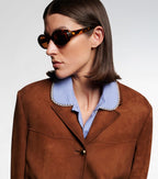 Miu Miu Logo Oval Sunglasses in Tortoiseshell