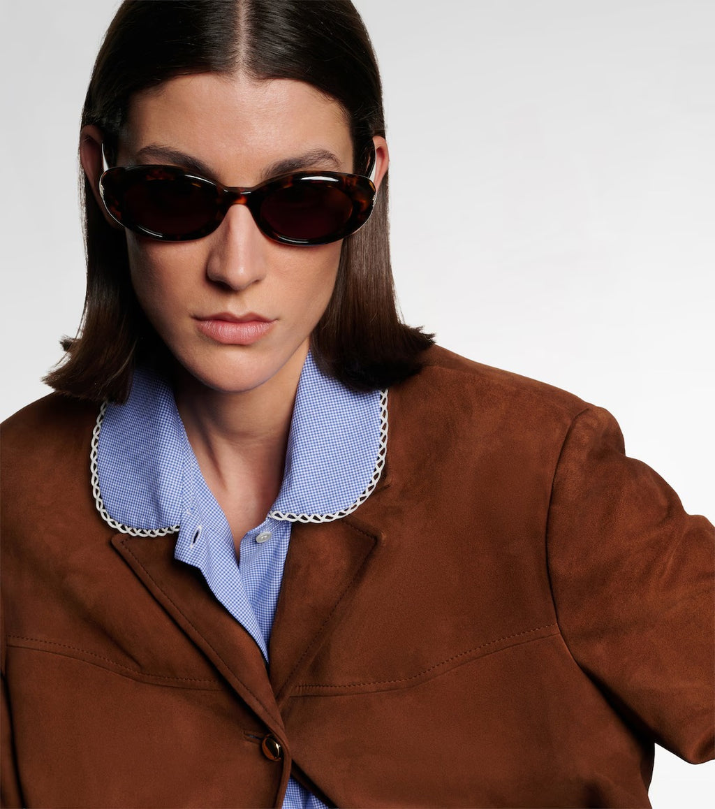 Miu Miu Logo Oval Sunglasses in Tortoiseshell