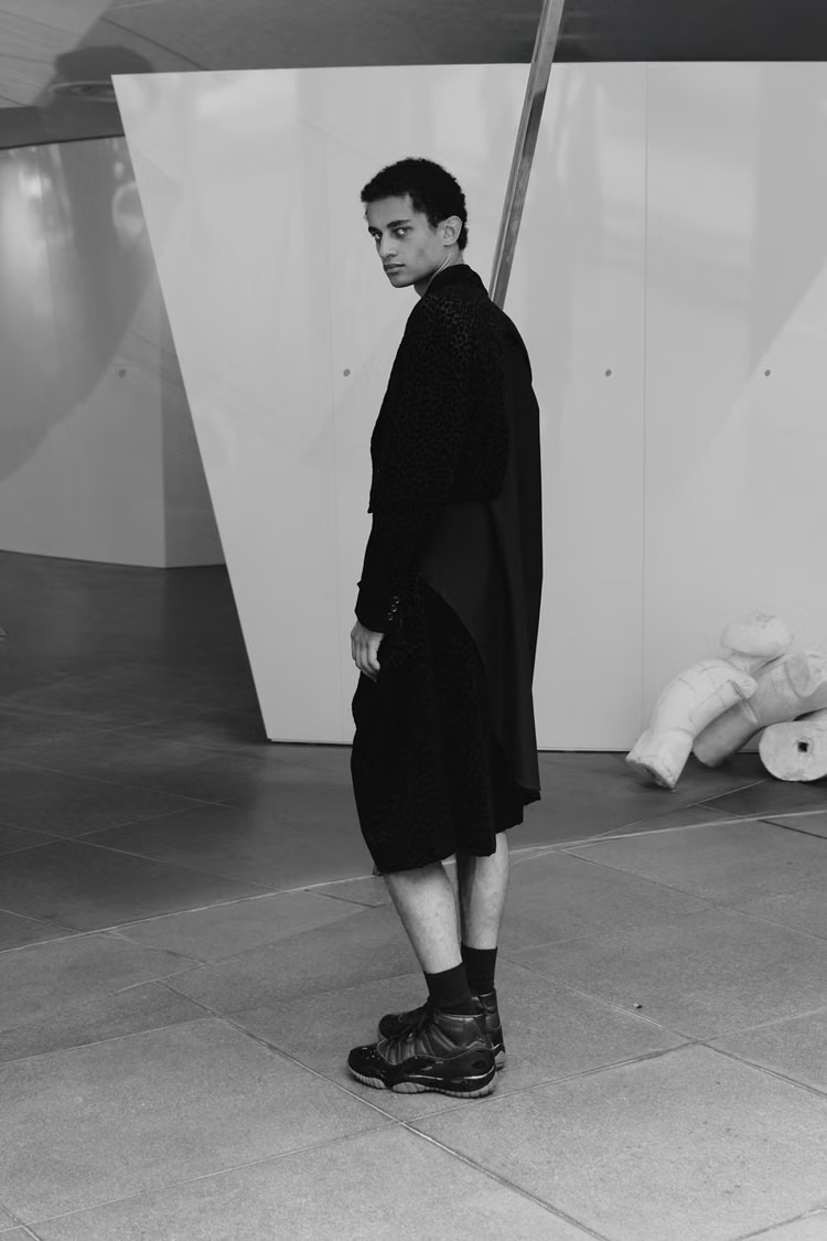 Model wearing the black Comme des Garçons Homme Plus x Air Jordan 11