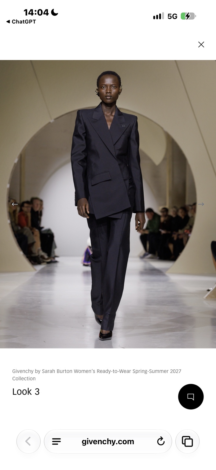 Immaculate dark Givenchy trouser suit on a buzz-cut model