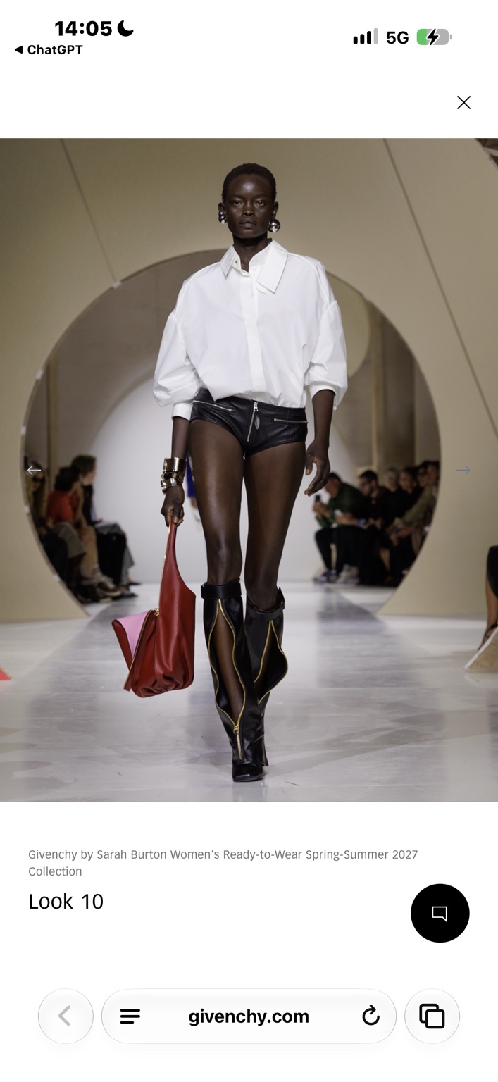 Oversized white shirt with tiny leather shorts and tall cutout boots