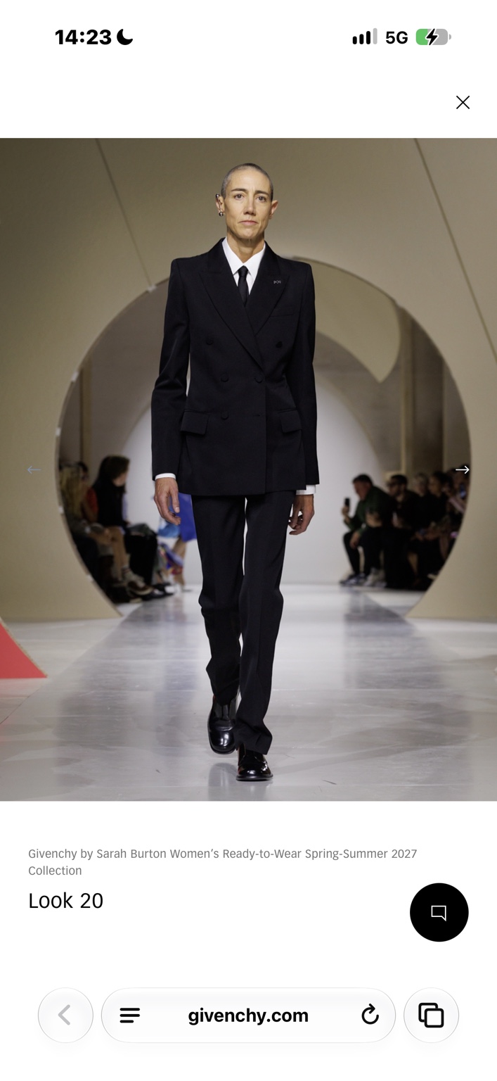 Black double-breasted trouser suit with white shirt and tie