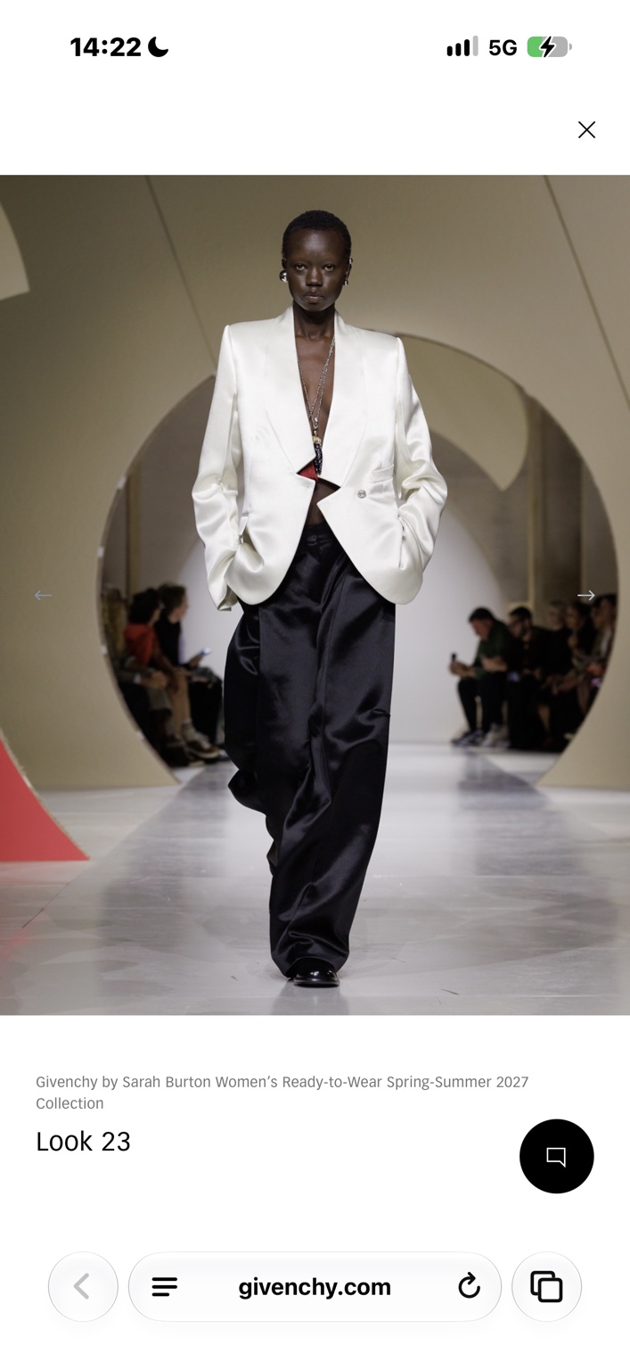 Ivory satin jacket with enormous black satin trousers
