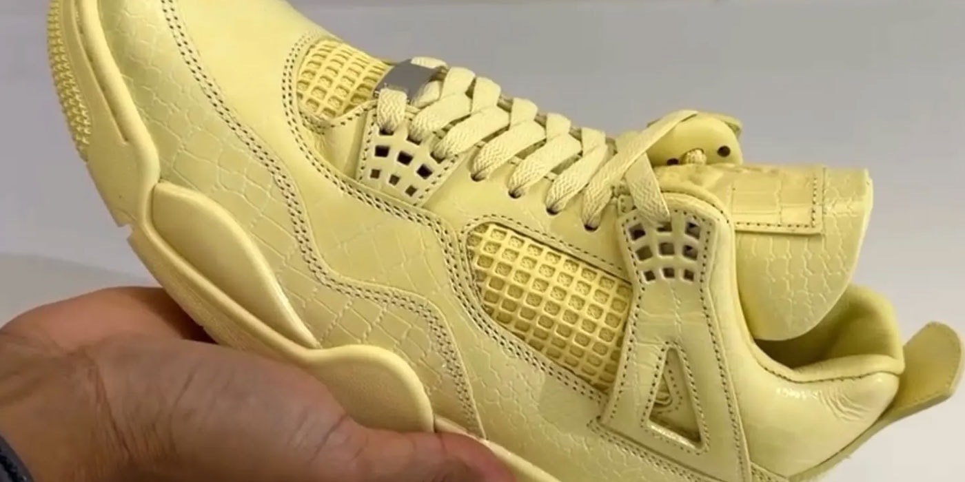 Pair of yellow J Balvin x Air Jordan 4 Lemonade trainers