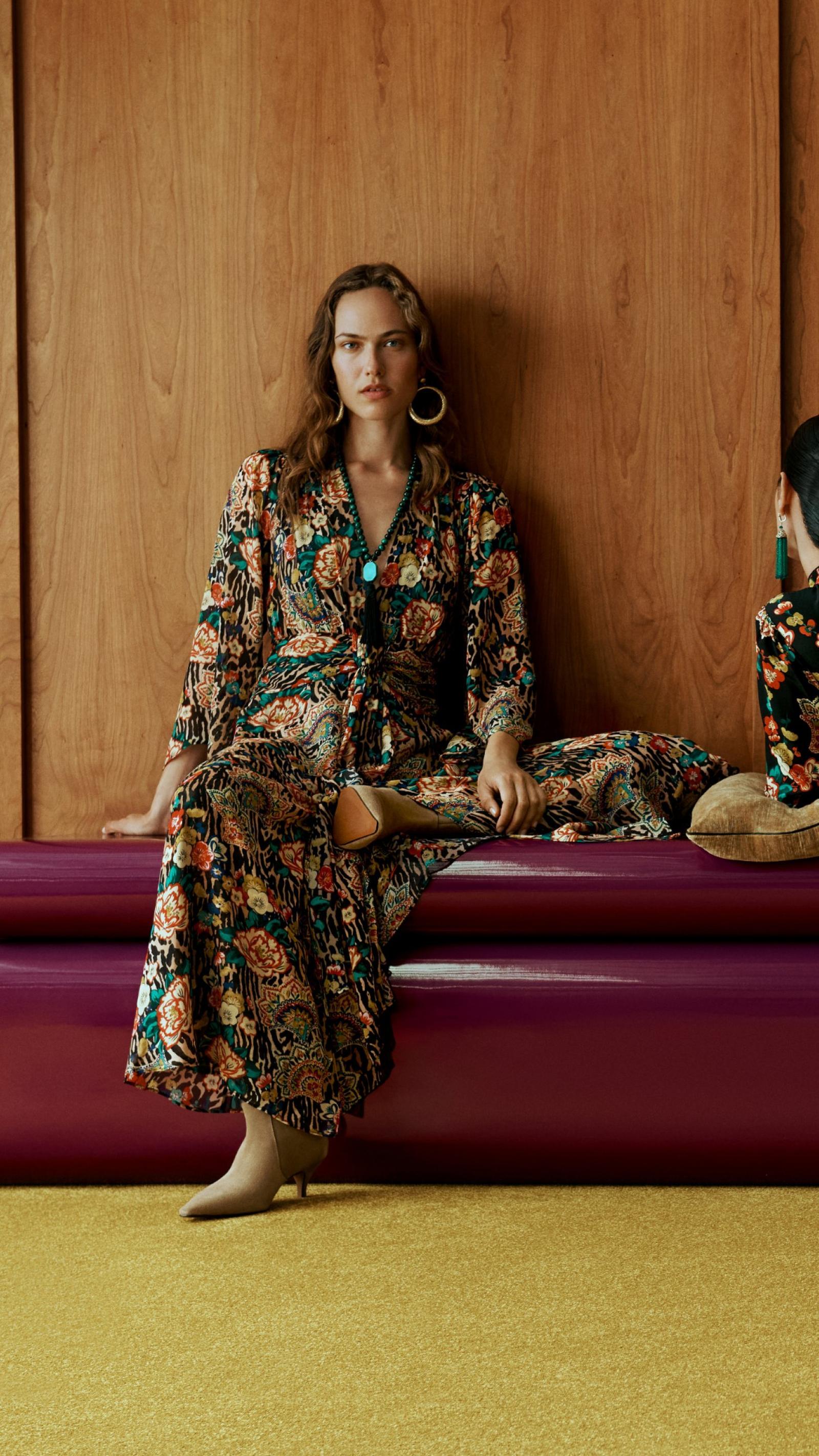 Model wearing the John Lewis x RIXO Vesper dress in an archive floral print