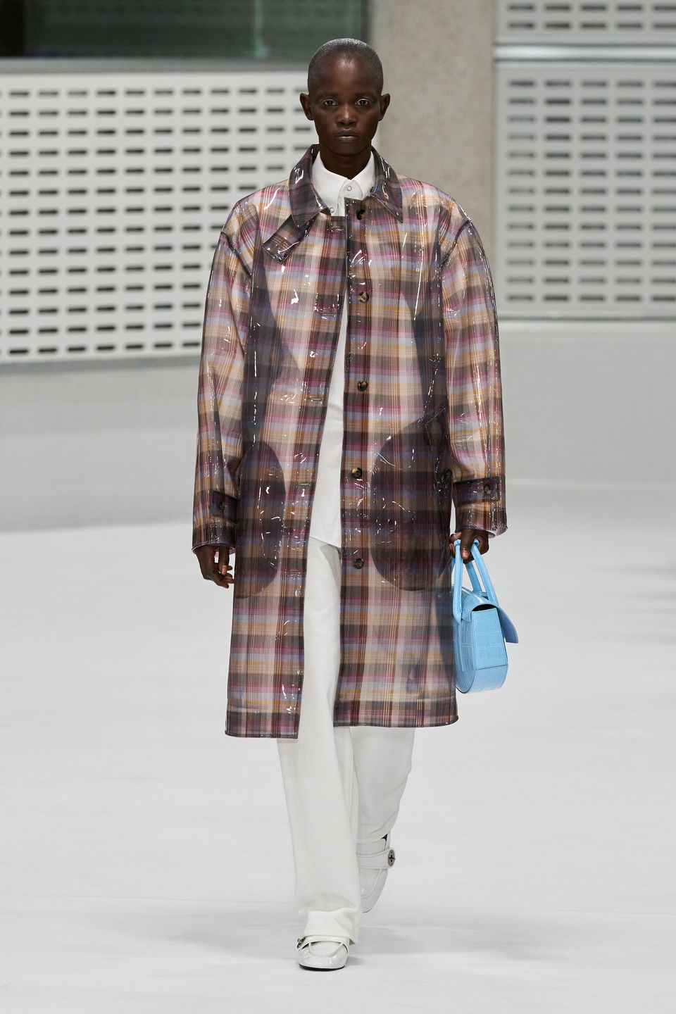 Translucent plaid mac worn with a pale-blue Mulberry bag on the Spring 2027 runway