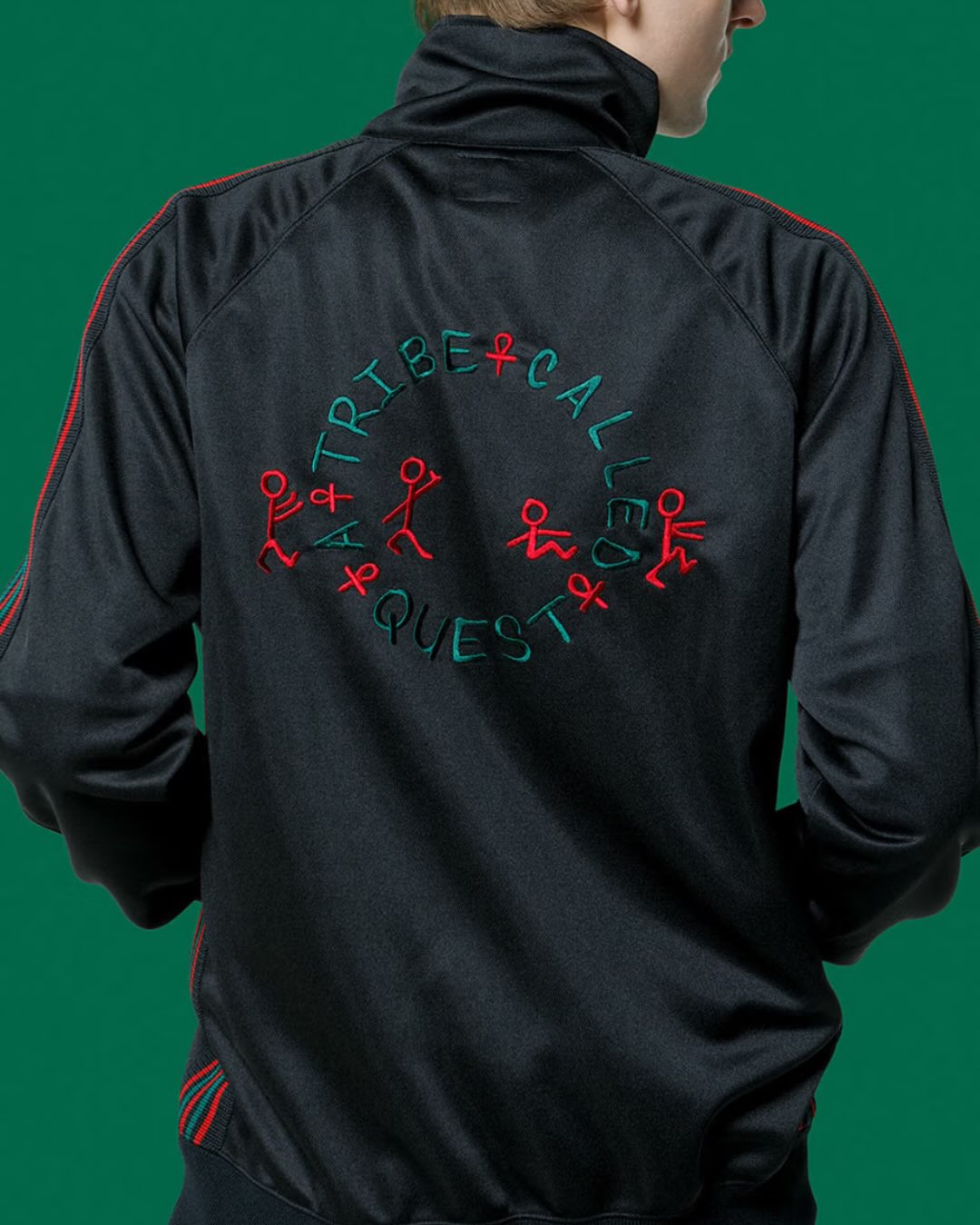 Back of the black track jacket with embroidered A Tribe Called Quest graphics
