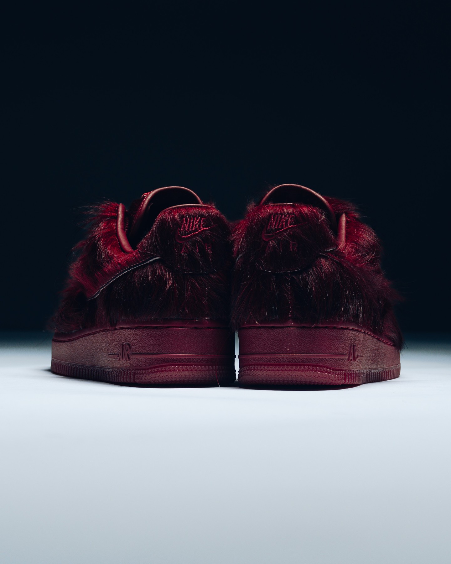 Rear view of the burgundy pony-hair Nike Air Force 1 Team Red