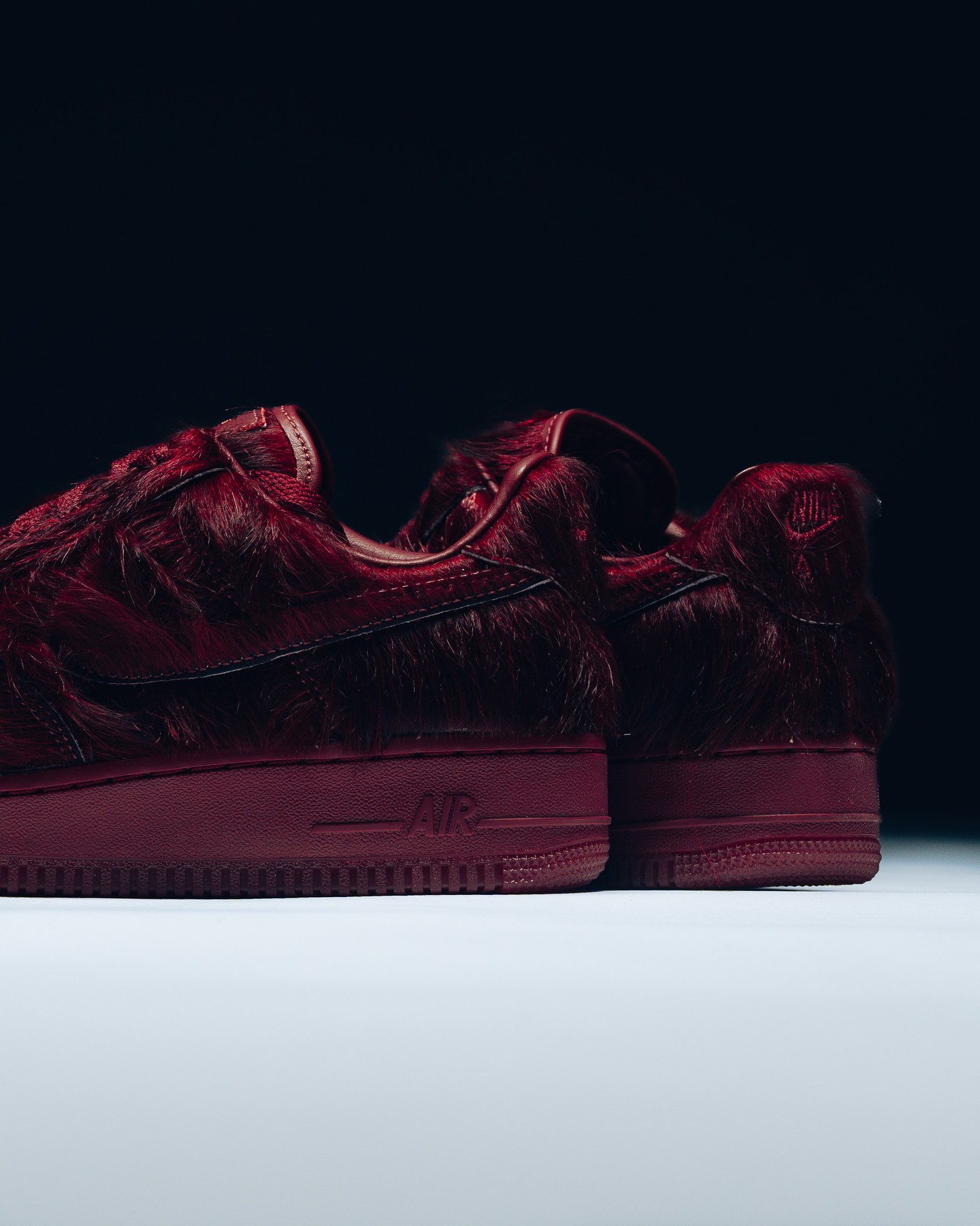 Nike Air Force 1 Team Red trainers covered in deep burgundy pony hair