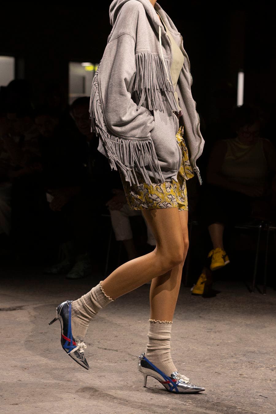 Silver pointed Onitsuka Tiger pumps with blue and red stripes and kitten heels on the Spring/Summer 2027 runway