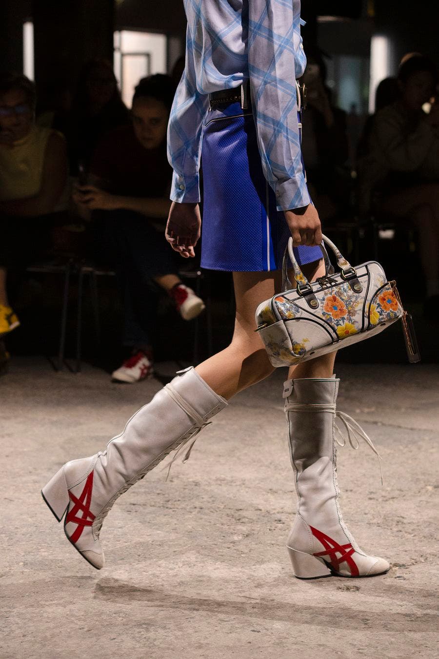 White knee-high Onitsuka Tiger lace-up boots with red stripes and heels