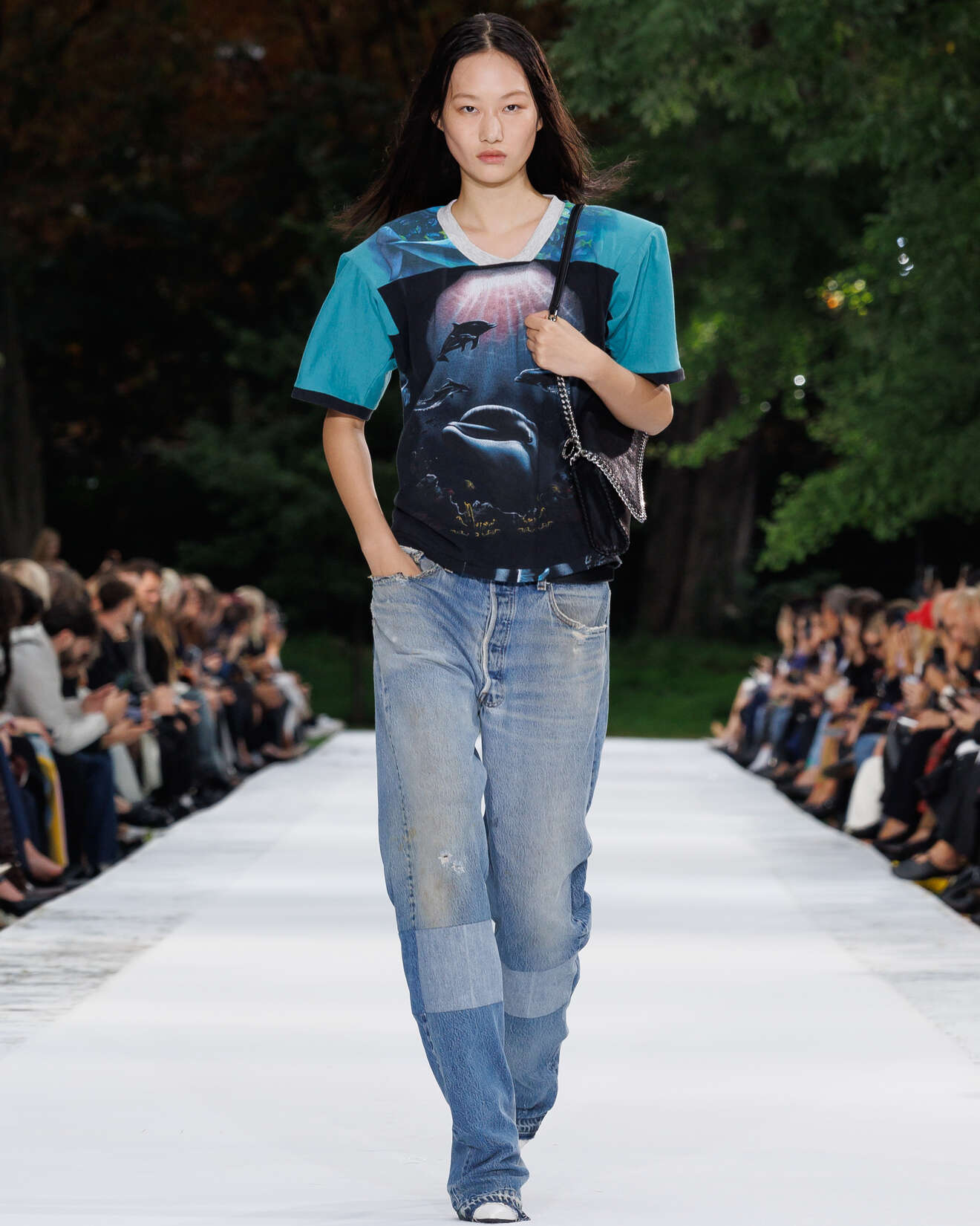 Dolphin-print Stella McCartney T-shirt worn with patchworked loose jeans