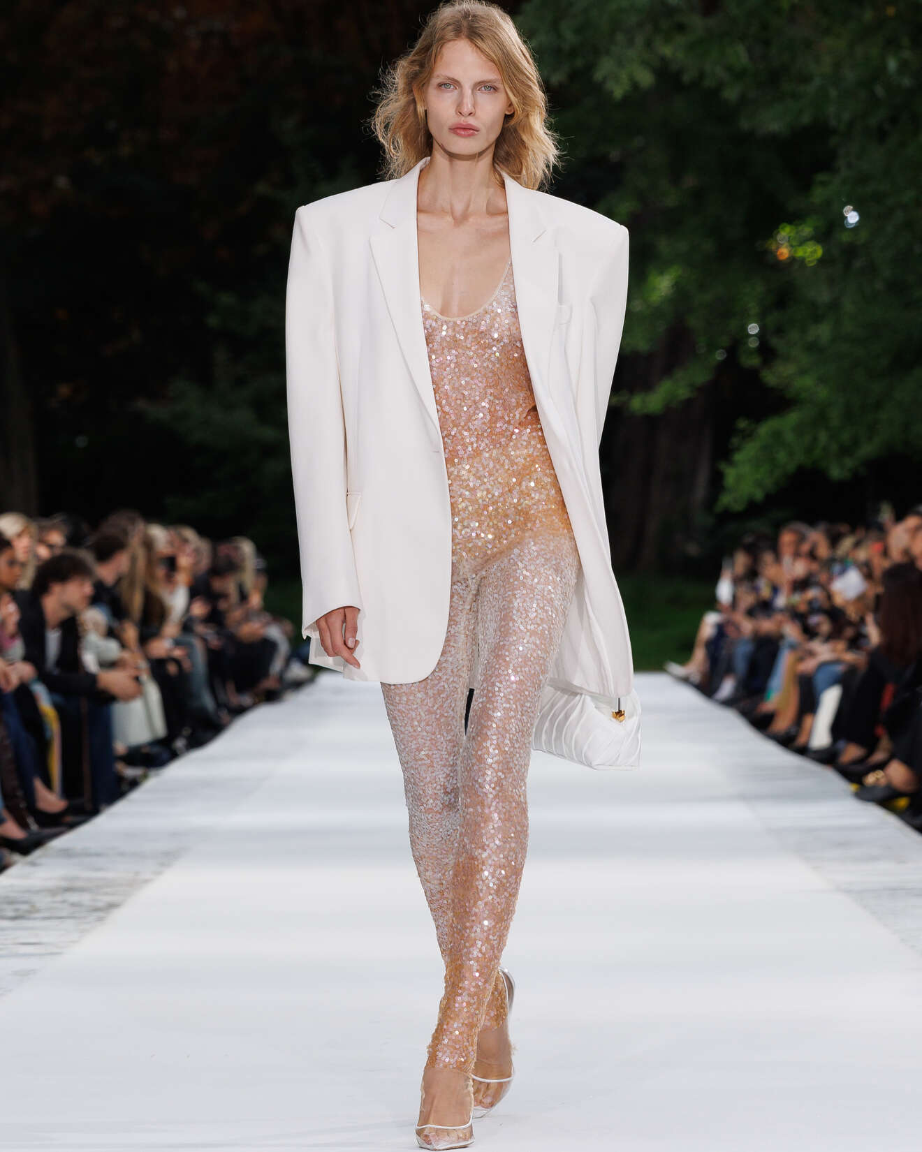 White oversized blazer worn over a nude-toned sequin catsuit on the Stella McCartney Summer 2027 runway