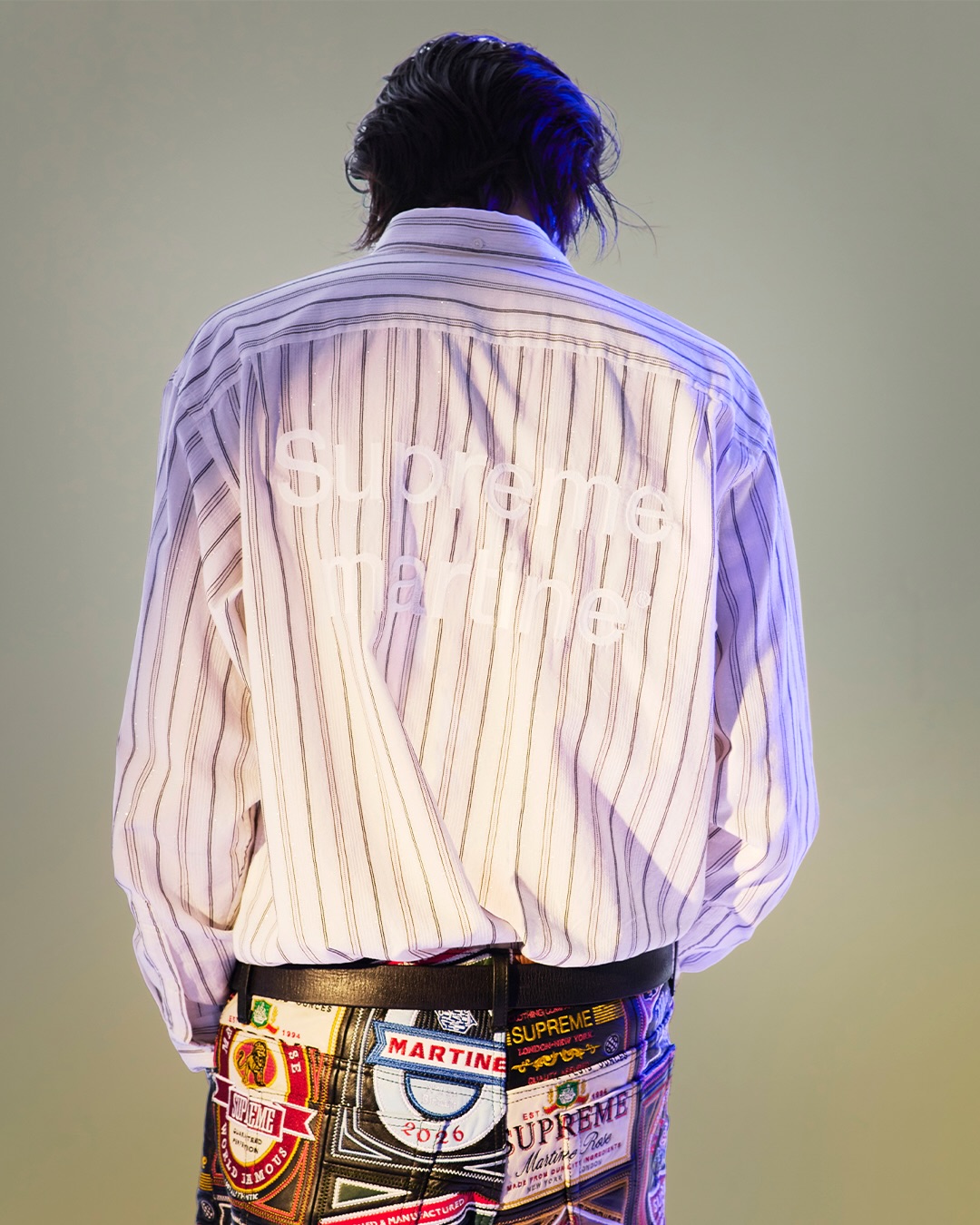 Back view of a translucent striped Supreme Martine Rose shirt