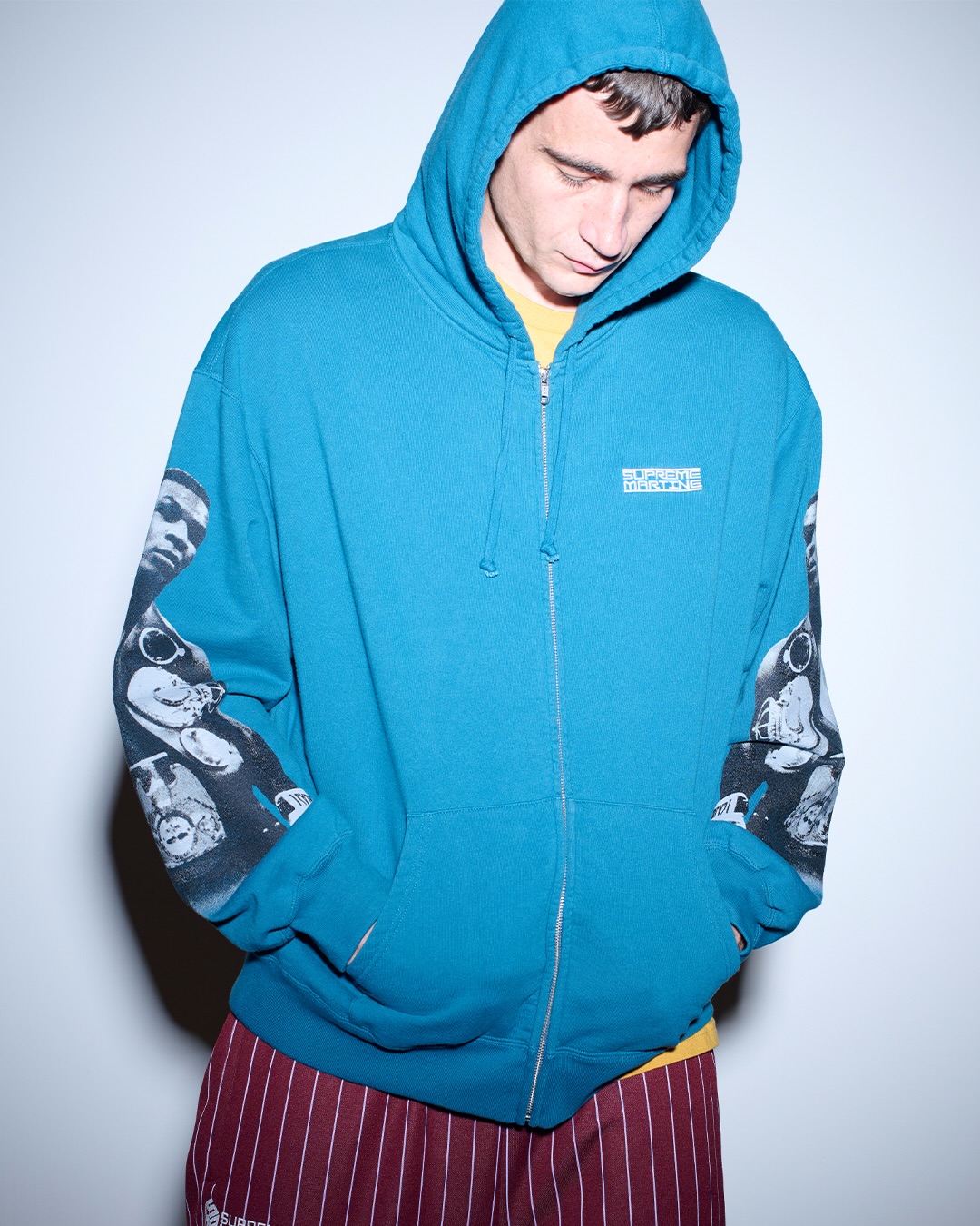 Blue Supreme Martine Rose hoodie with Mike Tyson imagery on the sleeves