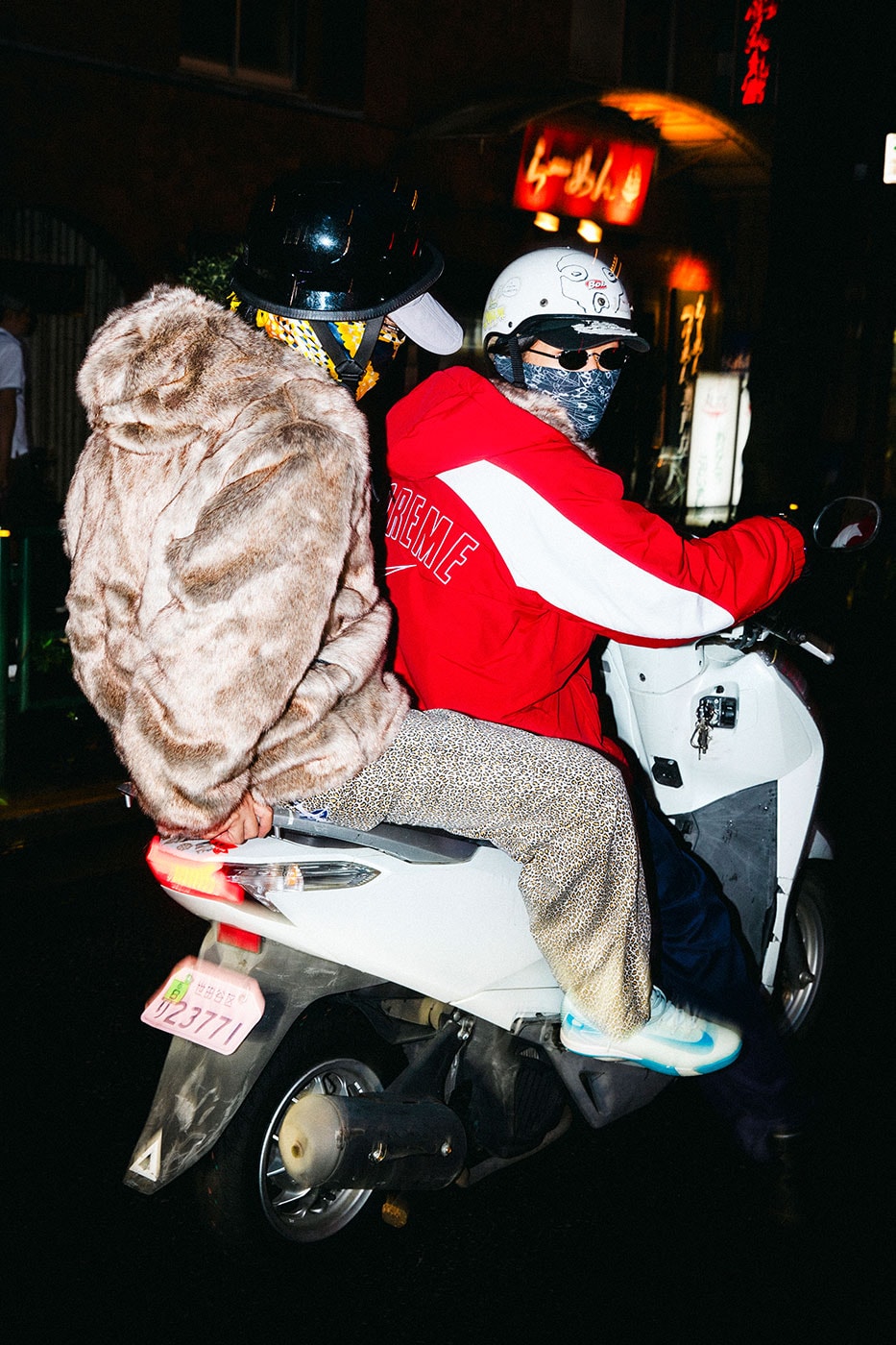 Navy Supreme x Nike hooded nylon jacket worn in the campaign