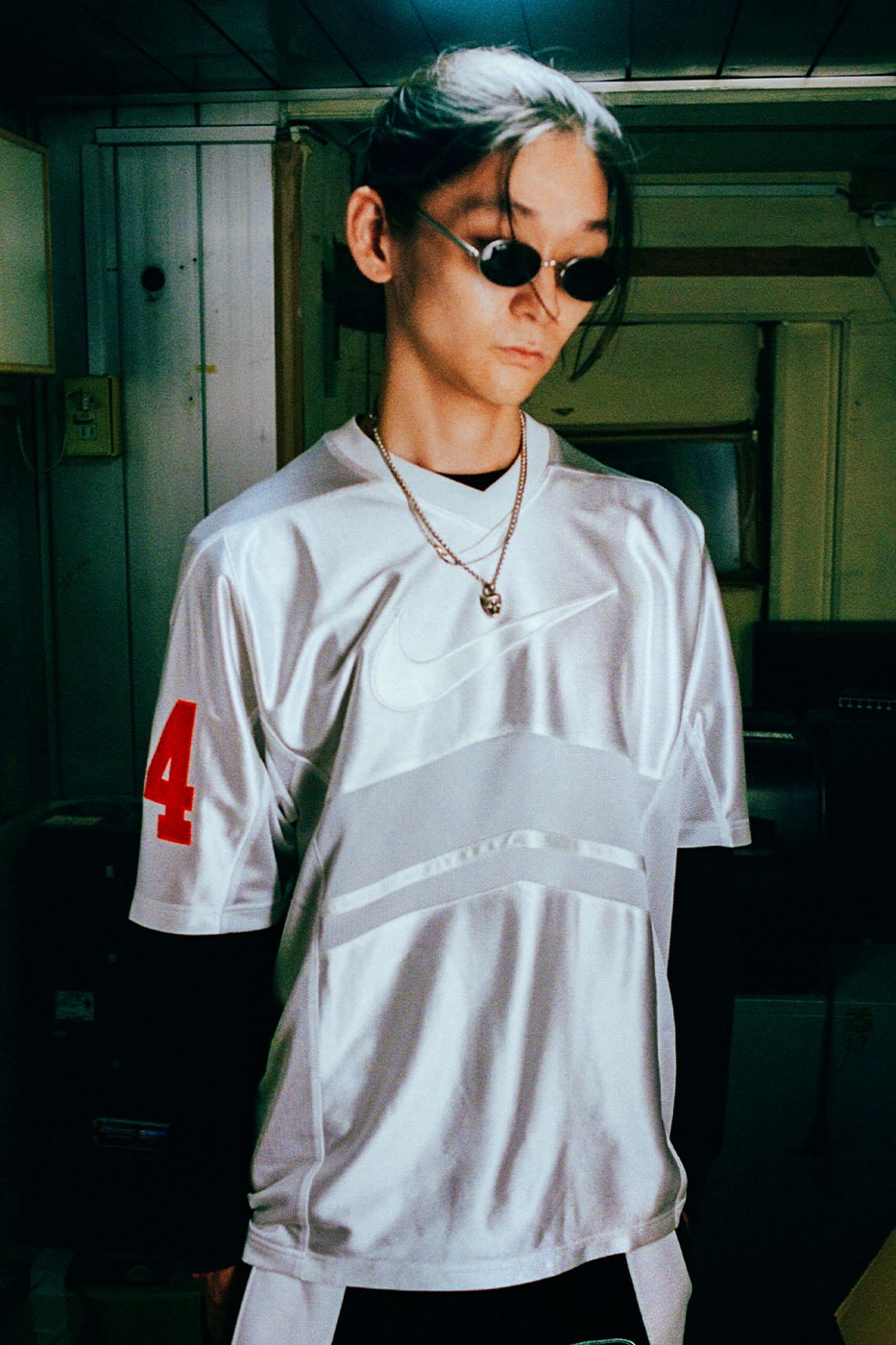 Silver Supreme x Nike football jersey with red numbering