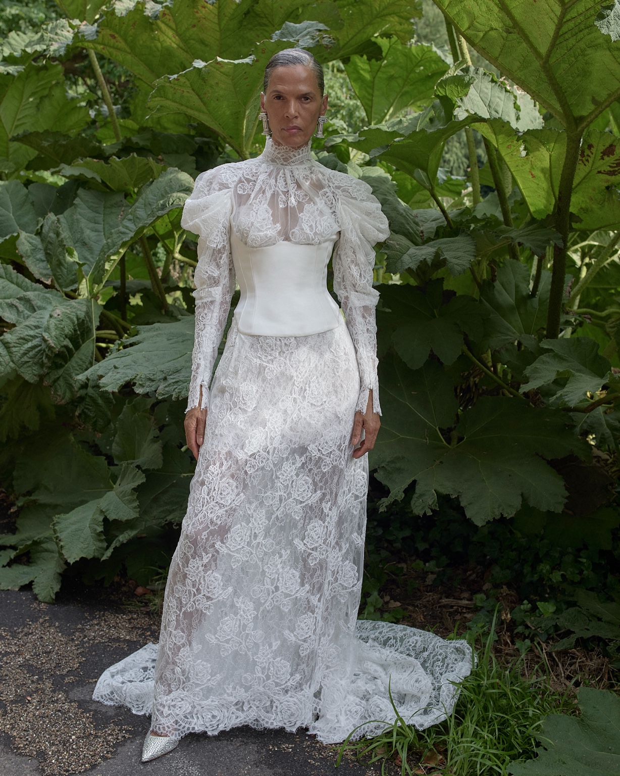 Vivienne Westwood 2027 high-neck lace bridal gown with puffed shoulders